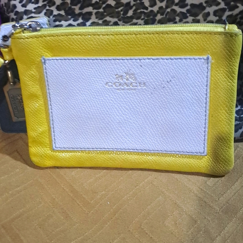 A yellow Coach hand bag